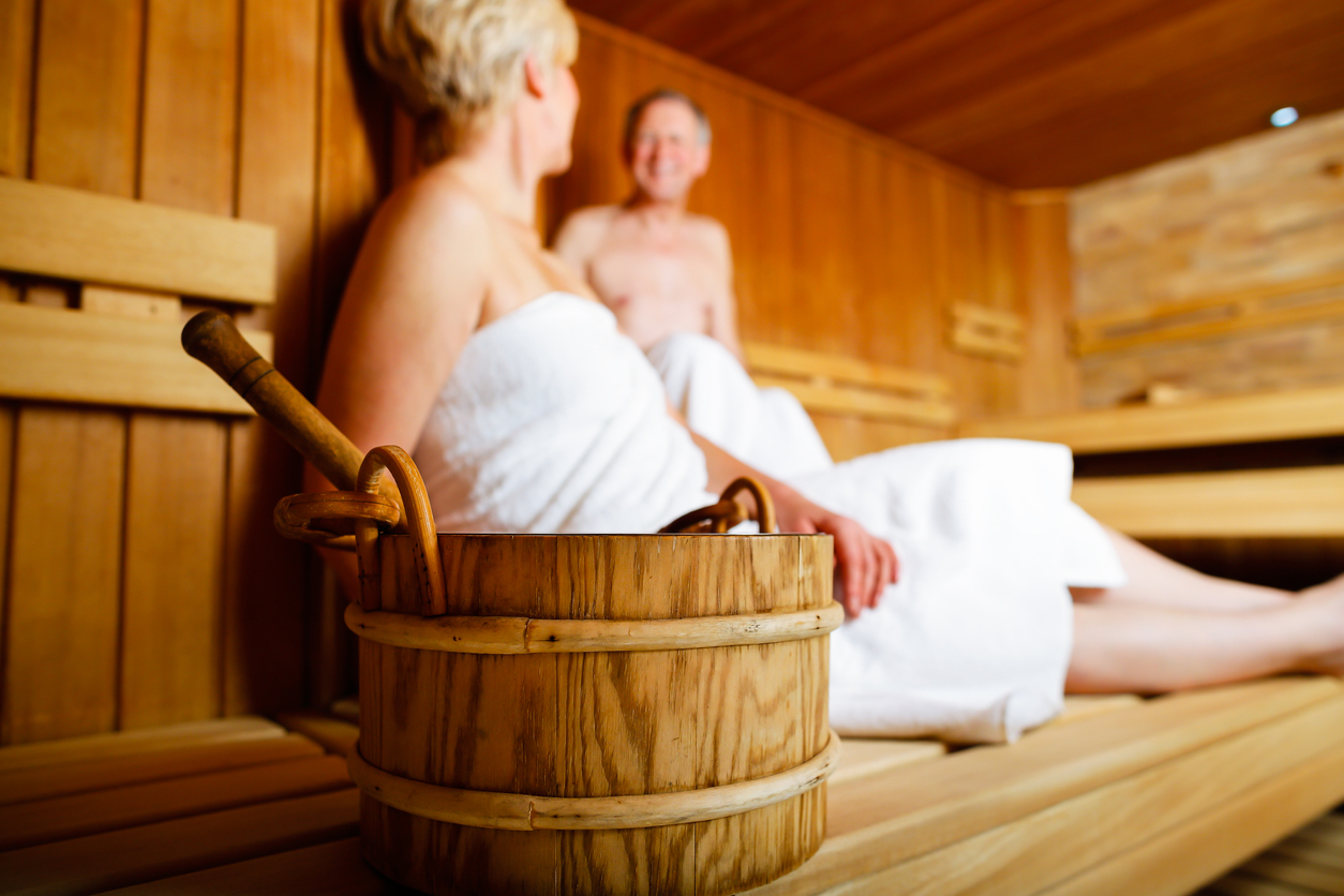 Seniors in sauna sweating and relaxing