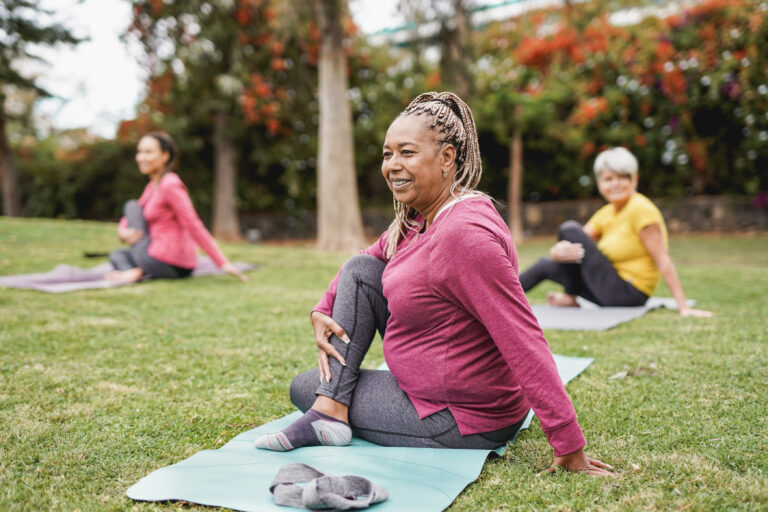 Woman stretching after yoga - recover after workout