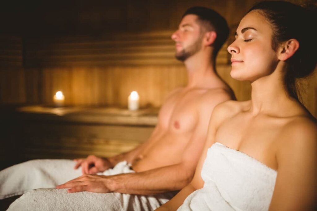 happy couple enjoying sauna together